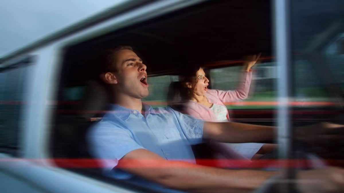 Man and woman driving fast