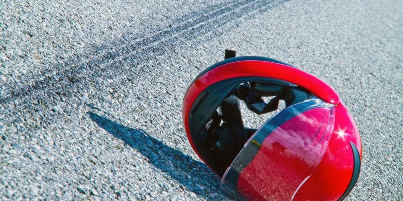 Motorcycle Accident Helmet in Road